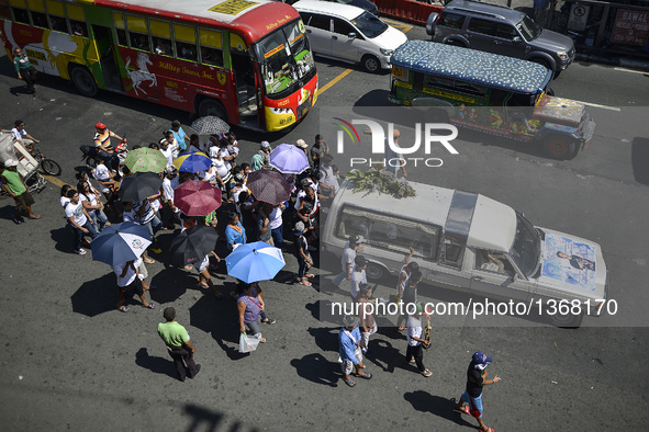 Relatives of a suspected drug pusher and victim of a vigilante-style execution take part in a burial ceremony in Pasay, south of Manila, Phi...