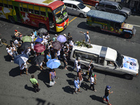 Relatives of a suspected drug pusher and victim of a vigilante-style execution take part in a burial ceremony in Pasay, south of Manila, Phi...