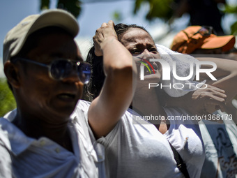 The wife of a suspected drug pusher and victim of a vigilante-style execution grieves during a burial ceremony in Pasay, south of Manila, Ph...