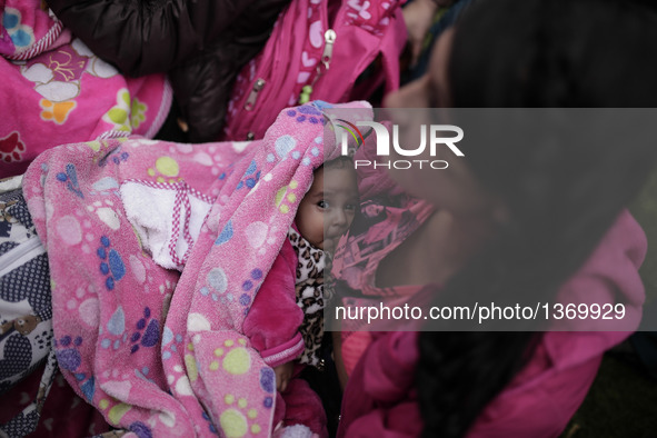 A woman feeds her baby during a public breastfeeding event in Bogota, capital of Colombia, on Aug. 3, 2016. The event is held for the World...