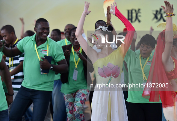 A Chinese girl dances at the 2016 China-Africa Youth Gala in Guangzhou, capital of south China's Guangdong Province, Aug. 4, 2016. The youth...