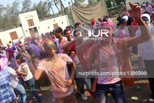 Young men dance at the India Color Festival during a high temperature summer day in Cairo, Egypt, on August 12, 2016.