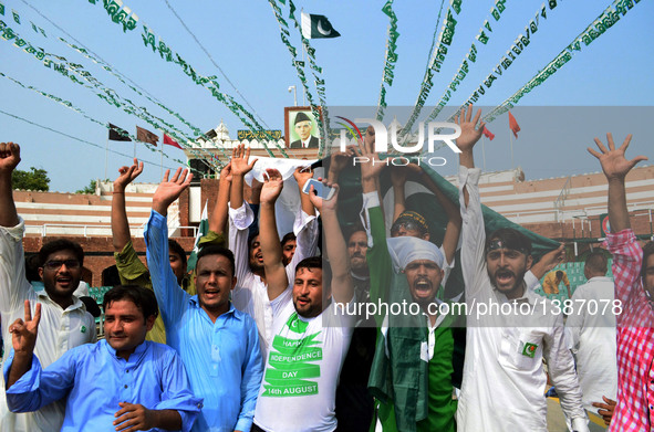 Pakistani people attend a ceremony celebrating Pakistan's Independence Day in eastern Pakistan's Lahore on Aug. 14, 2016.