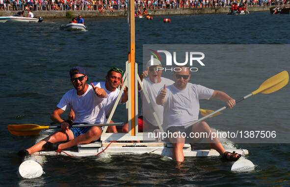 Participants take part in the International Bathtub Regatta on the Meuse River in Dinant, southern Belgium on Aug. 15, 2016. Starting in 198...