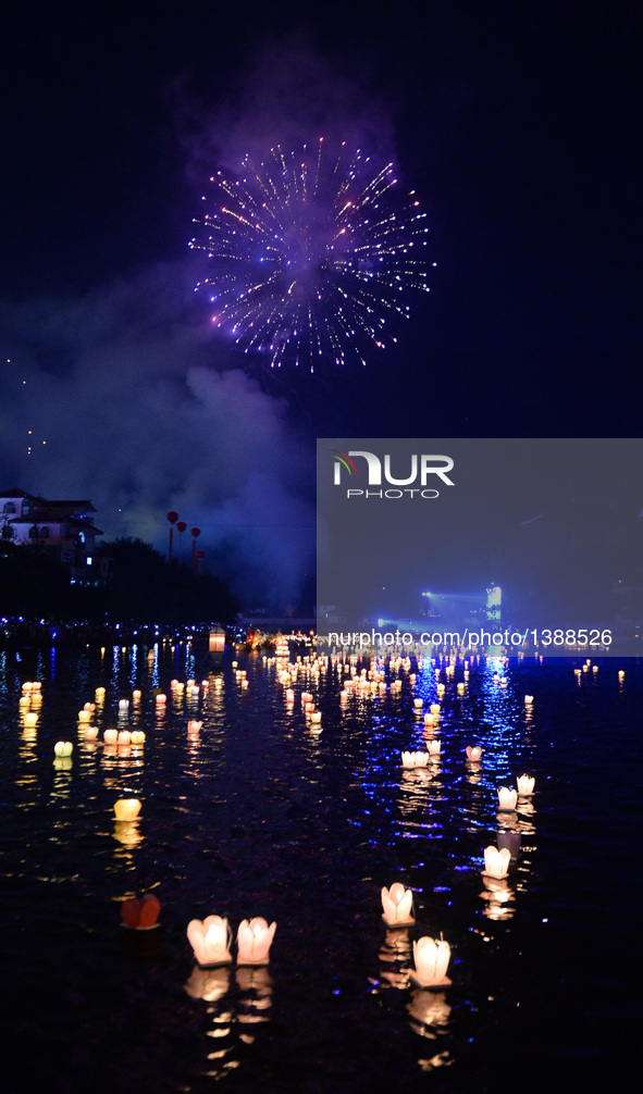 Photo taken on Aug. 16, 2016 shows lanterns in the river during a traditional lantern fair in Ziyuan County, south China's Guangxi Zhuang Au...