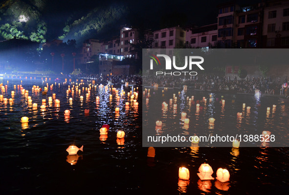 Photo taken on Aug. 16, 2016 shows lanterns in the river during a traditional lantern fair in Ziyuan County, south China's Guangxi Zhuang Au...