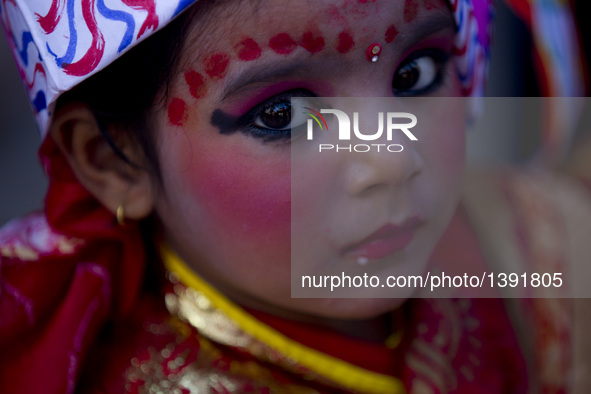 A girl with makeup on her face participates in a parade during the Gaijatra festival, or the festival of cows, in Kathmandu, capital of Nepa...