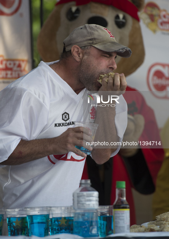 Geoff Esper competes in the Gyoza Eating Championship in Los Angeles, the United States, Aug. 20, 2016. Geoff Esper finished 243 gyozas in t...