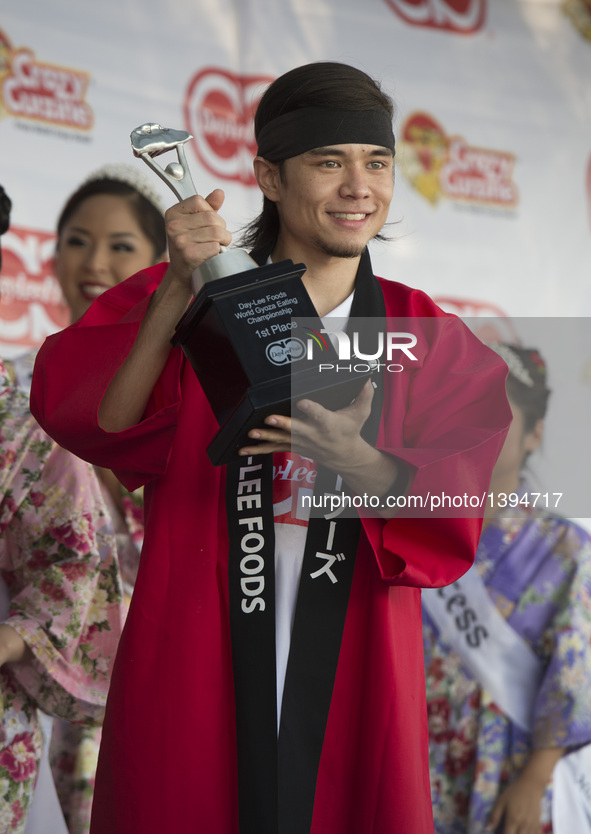 Matt Stonie celebrates after the Gyoza Eating Championship in Los Angeles, the United States, Aug. 20, 2016. Matt Stonie finished 323 gyozas...