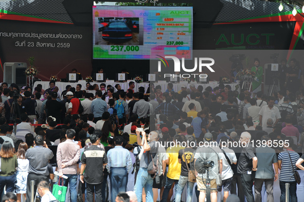 People attend an auction of seized luxury cars at the Thai Customs headquarters in Bangkok Aug. 23, 2016. A total of 343 seized luxury cars...