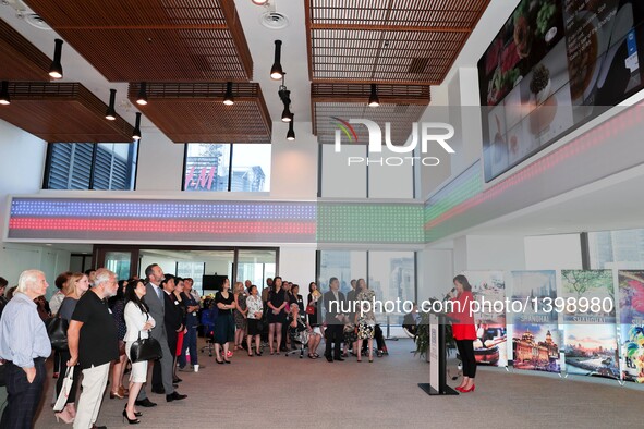 Visitors watch a promotional video on China's Shanghai during a tourism promotion event in New York, the United States, Aug. 23, 2016. China...