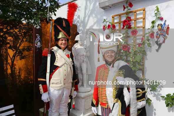 Jasques Fieuw and his wife Pauline pose with a Napoleon sculpture in their garden in Brussels, Belgium, Aug. 16, 2016. Both Fieuw and his wi...