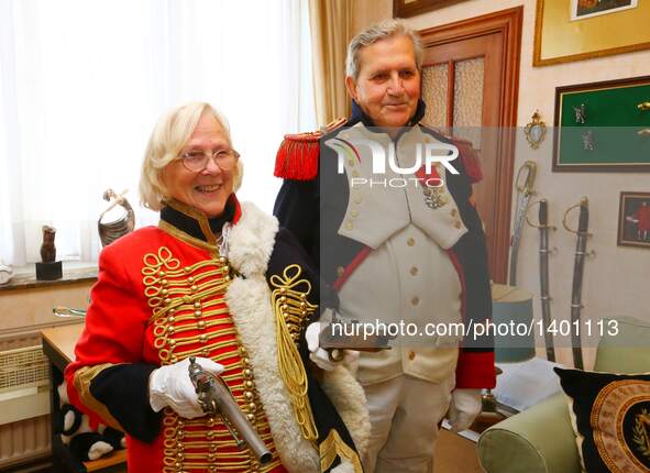 Jasques Fieuw and his wife Pauline present Napoleonic weapon replicas as they are dressed in Napoleonic French military uniforms at their ho...