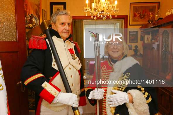 Jasques Fieuw and his wife Pauline are dressed in Napoleonic French military uniforms at their home in Brussels, Belgium, Aug. 16, 2016. Bot...