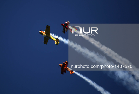 Three planes fly during an acrobatic show at the 5th Shenyang Faku International Flight Conference held in Faku County of Shenyang, capital...