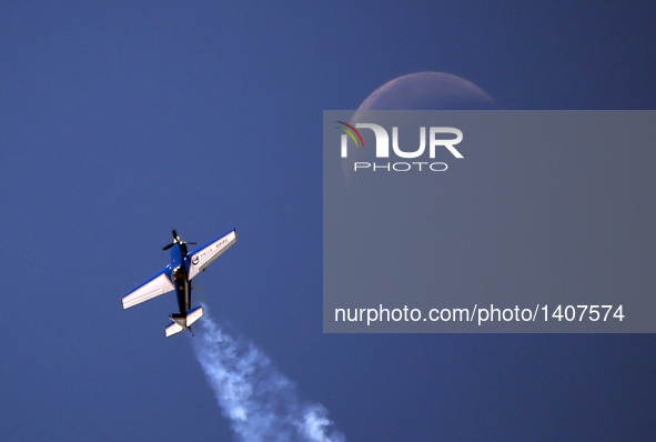 A plane flies during an acrobatic show at the 5th Shenyang Faku International Flight Conference held in Faku County of Shenyang, northeast C...