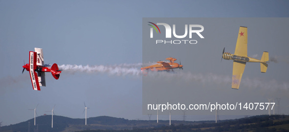 Three planes fly during an acrobatic show at the 5th Shenyang Faku International Flight Conference held in Faku County of Shenyang, capital...