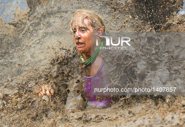 A participant takes part in the "2016 Mud Hero Toronto North" race at Albion Hills Conservation Area in Toronto, Canada, Aug. 27, 2016.