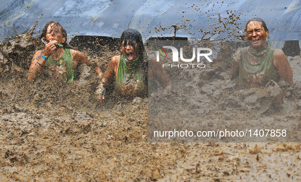 Participants take part in the "2016 Mud Hero Toronto North" race at Albion Hills Conservation Area in Toronto, Canada, Aug. 27, 2016.