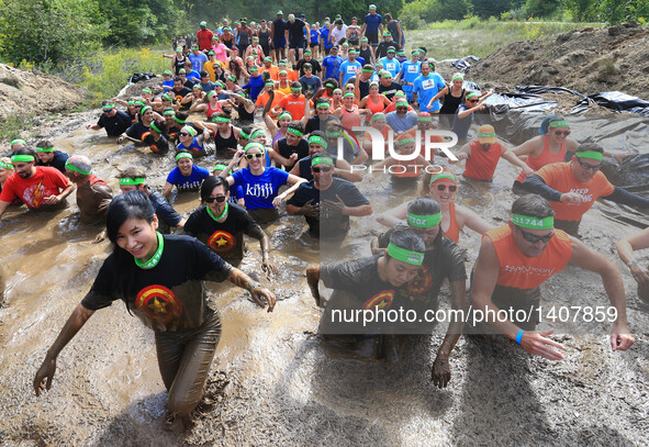 Participants take part in the "2016 Mud Hero Toronto North" race at Albion Hills Conservation Area in Toronto, Canada, Aug. 27, 2016.