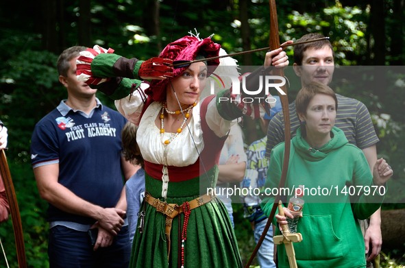 A woman dressed as an archer performs during "Volga standard", a festival reenacting the Middle Ages and the lifestyle of the Slavic people...