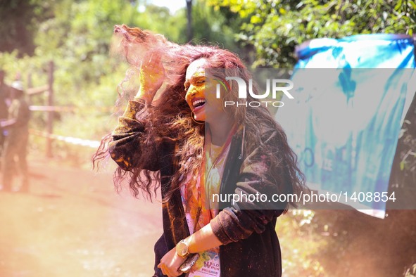 A runner participates in the Color Run in Nairobi, capital of Kenya, Aug. 28, 2016. The Color Run, known as "Happiest 5km on the Planet", wa...