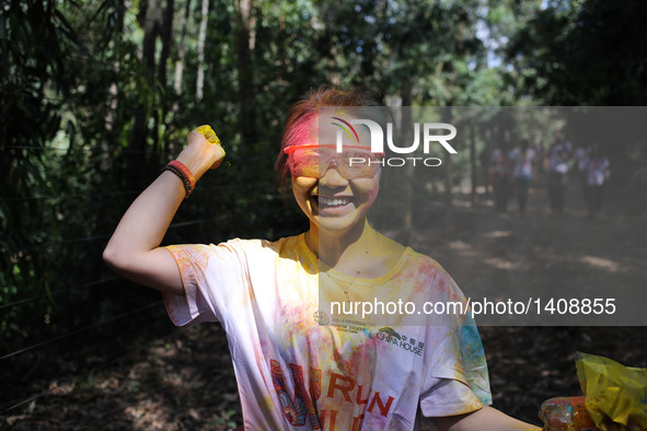 A runner participates in the Color Run in Nairobi, capital of Kenya, Aug. 28, 2016. The Color Run, known as "Happiest 5km on the Planet", wa...