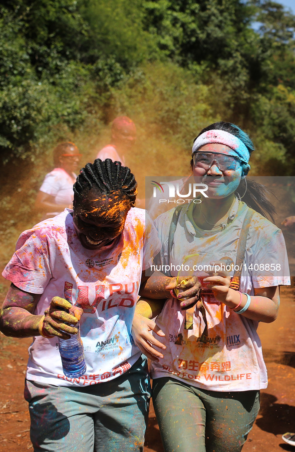 Runners participate in the Color Run in Nairobi, capital of Kenya, Aug. 28, 2016. The Color Run, known as "Happiest 5km on the Planet", was...