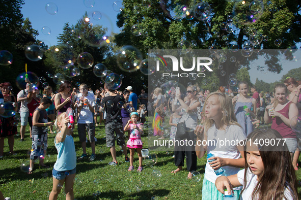 Participants blow soap bubbles on the soap bubble day at a park in Budapest, Hungary, Aug. 28. 2016.