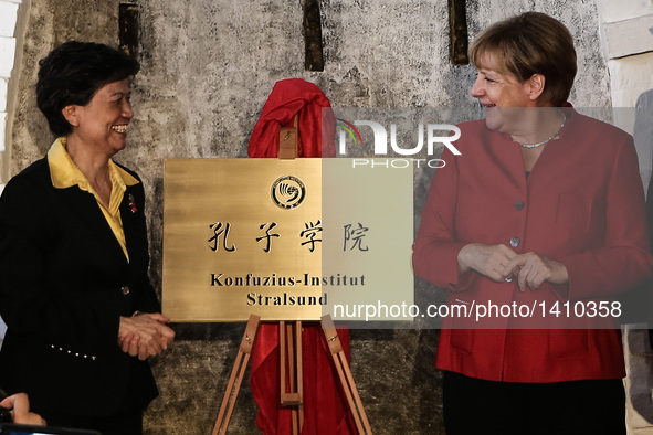 German Chancellor Angela Merkel (R) attends the opening ceremony of the Confucius Institute in Stralsund Aug. 30, 2016. Angela Merkel on Tue...