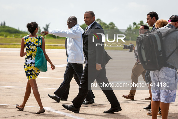 U.S. Secretary of Transportation Anthony Foxx (3rd L) arrives with the first regular direct commercial flight from the United States to Cuba...