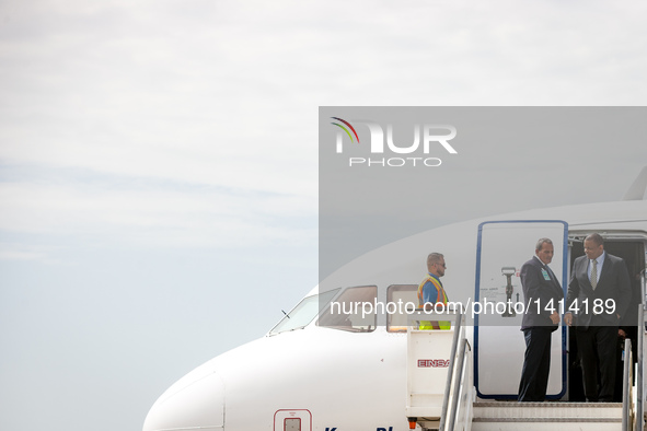 U.S. Secretary of Transportation Anthony Foxx (1st R) steps out of the first commercial flight from U.S., at the Abel Santamaria Internation...