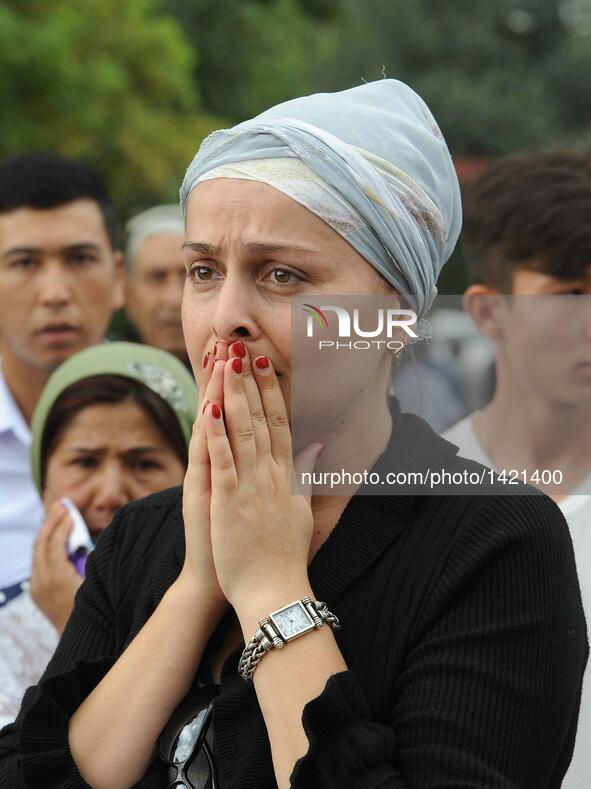 A woman cries for the death of the late president of Uzbekistan Islam Karimov in Samarkand, Uzbekistan, on Sept. 3, 2016. The funeral of the...