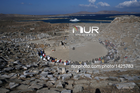 Spectators watch a performance of "Hecuba (Ekavi), A Refugee on Delos", at the ruins of the ancient theater of Delos island in Greece, Sept....