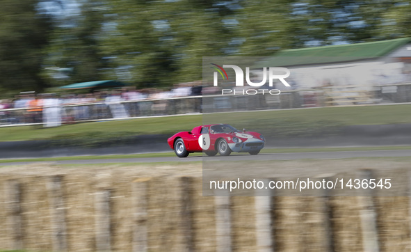 A vintage race car takes part in a race at the Goodwood Revival 2016 in Goodwood, south England, Sept. 11, 2016.