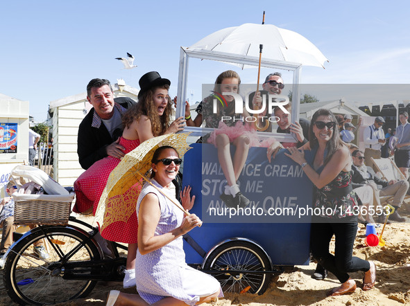 People dressed in vintage clothes attend the Goodwood Revival 2016 in Goodwood, near Chichester in south England, on Sept. 11, 2016.