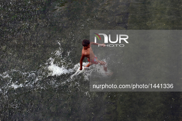 An Egyptian boy plays in the River Nile during the Eid al-Adha festival in Qaliubiya, Egypt on Sept. 14, 2016.