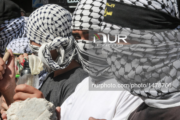 Palestinian militants from the Islamic Jihad (Holy War) take part in a demonstration marking the one year anniversary of latest round of Pal...