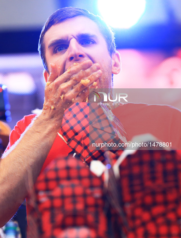 A contestant takes part in the 7th Annual World Poutine Eating Championship in Toronto, Canada, Oct. 1, 2016. Joey Chestnut of the United St...