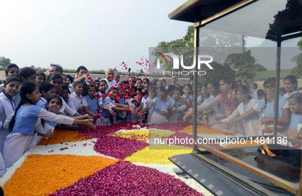 People pay tribute to Mahatma Gandhi during a remembrance ceremony for his 147th birth anniversary at Rajghat in New Delhi, India, Oct. 2, 2...