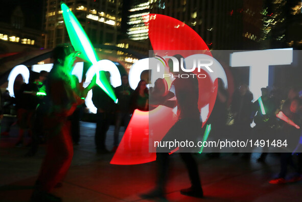 Participants attend the 2016 Glow Sword Battle in Toronto, Canada, Oct. 8, 2016. Hundreds of Star Wars fans took part in the annual event on...