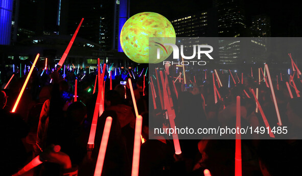 Participants attend the 2016 Glow Sword Battle in Toronto, Canada, Oct. 8, 2016. Hundreds of Star Wars fans took part in the annual event on...