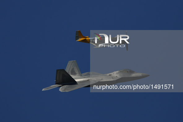 A U.S. Air Force F-22 Raptor (below) is seen in an air show in San Francisco, the United States, on Oct. 8, 2016. An air show featuring the...