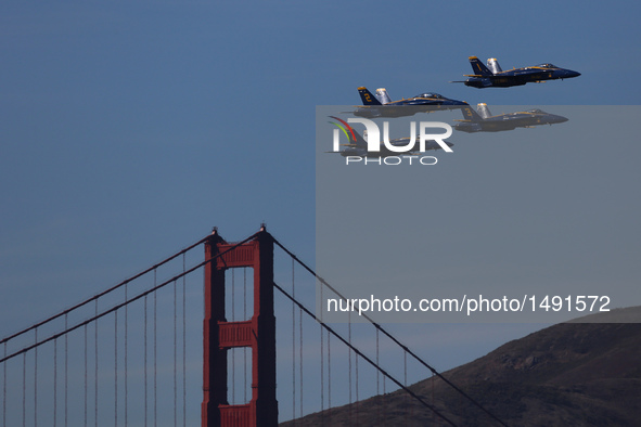 The U.S. Navy Blue Angels fly over the Golden Gate Bridge in an air show in San Francisco, the United States, on Oct. 8, 2016. An air show f...