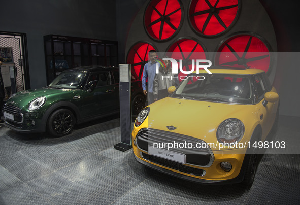 People visit the Wuhan Motor Show 2016 in Wuhan, capital of central China's Hubei Province, Oct. 12, 2016. Over 300 exhibitors from more tha...