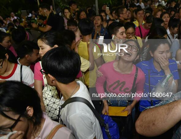 People mourn for the death of Thai King Bhumibol Adulyadej outside Siriraj Hospital in Bangkok, capital of Thailand, on Oct. 13, 2016. Thai...