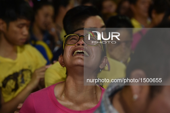 A woman grieves over the death of Thai King Bhumibol Adulyadej outside Siriraj Hospital in Bangkok, capital of Thailand, on Oct. 13, 2016. T...