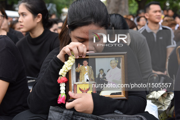 A woman mourns for Thai King Bhumibol Adulyadej near the Grand Palace in Bangkok, Thailand, on Oct. 14, 2016. The remains of Thai King Bhumi...