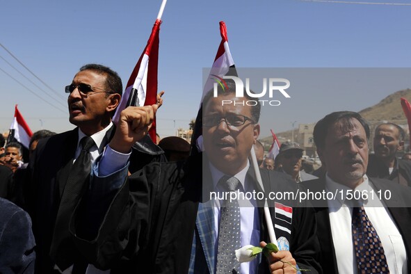 Yemenis shout slogans during a rally in solidarity and honor of the Oct. 8 airstrikes' victims outside the funeral hall, in Sanaa, Yemen, Oc...