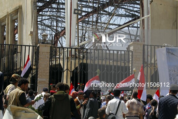 Yemenis take part in a rally in solidarity and honor of the Oct. 8 airstrikes' victims outside the funeral hall, in Sanaa, Yemen, Oct. 15, 2...